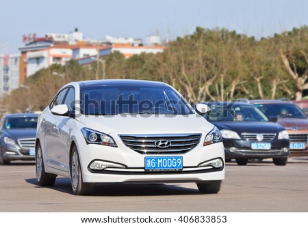 YIWU-CHINA-JAN. 25, 2016. White Hyundai Sonata. Hyundai and its affiliate Kia, which aims sell over 8 million cars in the global market, have been hit by the China shock since the beginning of 2016.