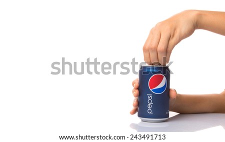 KUALA LUMPUR, MALAYSIA - JANUARY 12TH, 2015. Opening a can of Pepsi . Pepsi is a carbonated soft drink produced and manufactured by PepsiCo Inc. an American multinational food and beverage company.