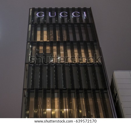 TOKYO, JAPAN - 13TH MAY 2017. Gucci store front in Ginza Street at night. It is an Italian luxury brand of fashion and leather goods and the biggest-selling Italian brand in the world.