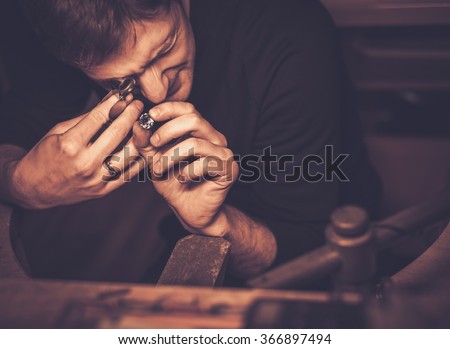 Portrait of a jeweler during the evaluation of jewels.