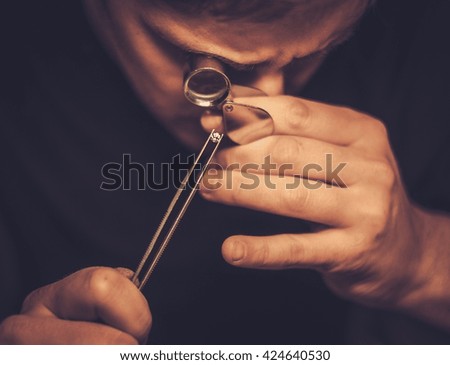 Jeweler during the evaluation of jewels.