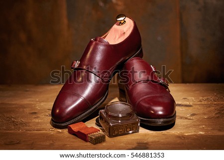 Still life with men's leather shoes and accessories for shoes care
