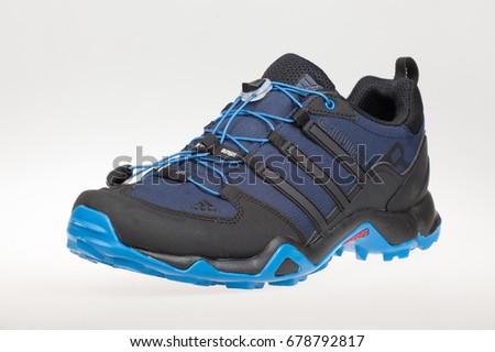 Varna , Bulgaria - JULY 5, 2017 : ADIDAS TERREX SWIFT sport shoe. Product shot. Adidas is a German corporation that designs and manufactures sports shoes, clothing and accessories