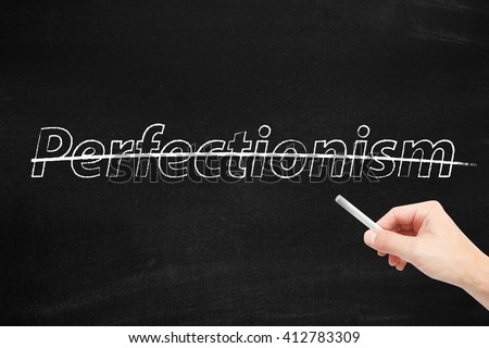 Perfectionism written on a blackboard