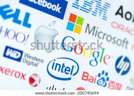 KIEV, UKRAINE - JUNE 12, 2014: A logotype collection of well-known world top companies of computer technologies on a monitor screen. Include Google, Apple, Microsoft, Intel and other logo.