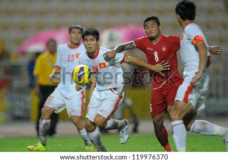 BANGKOK THAILAND-NOV 24:Nguyen Gia Tu#26 of Vietnam (white) in action during the AFF Suzuki Cup between Vietnam and Myanmar at Rajamangala stadium on Nov24, 2012 in Bangkok,Thailand.