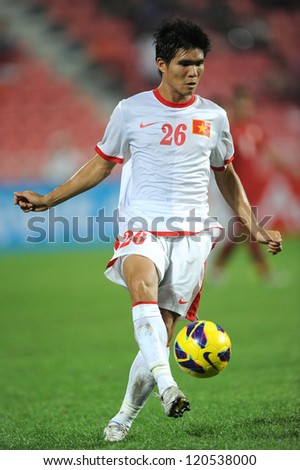 BANGKOK THAILAND-NOVEMBER 30:Nguyen Gia Tu of Vietnam runs with the ball during the AFF Suzuki Cup between Vietnam and Thailand at Rajamangala stadium on Nov30, 2012 in Bangkok,Thailand.
