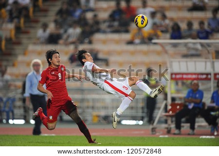 BANGKOK THAILAND-NOVEMBER 30:Nguyen Minh Duc of Vietnam ( white) in action during the AFF Suzuki Cup between Vietnam and Thailand at Rajamangala stadium on Nov30, 2012 in Bangkok,Thailand.