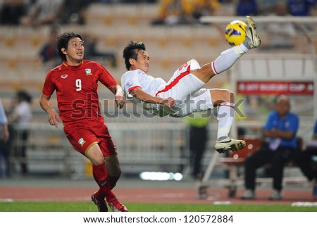 BANGKOK THAILAND-NOVEMBER 30:Nguyen Minh Duc of Vietnam ( white) in action during the AFF Suzuki Cup between Vietnam and Thailand at Rajamangala stadium on Nov30, 2012 in Bangkok,Thailand.