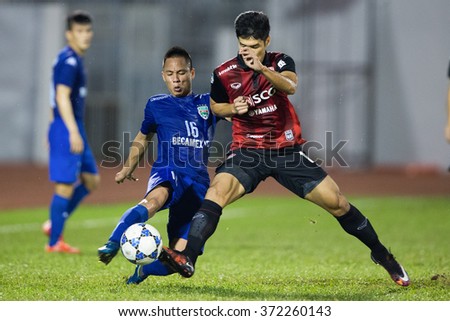 HO CHI MINH-VIETNAM JANUARY23:Nguyen Xuan Thanh (L) of Binh Duong in action during The SCG Muangthong Utd Asean Tour 2016 Binh Duong and Muangthong Utd at Thong Nhat Stadium on Jan23,2016 in Vietnam