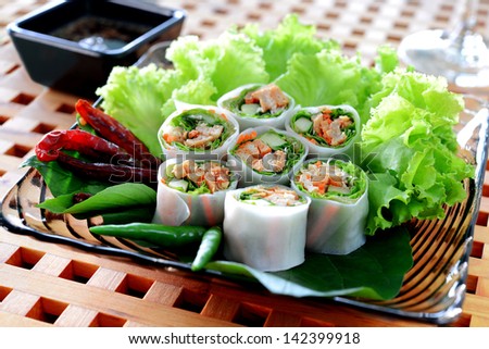 Delicious vietnamese spring roll with vegetable and chili