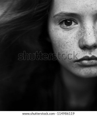 Black and white portrait of a beautiful girl with freckles Black and white portrait of a beautiful girl with freckles