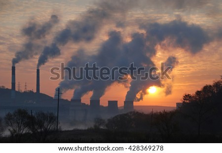 Factory pipe polluting air against sunset, environmental problems, smoke from chimneys