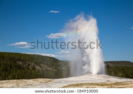 Old Faithful Geyser in Yellowstone National Park - available for royalty free licensing via Shutterstock in the portfolio of Edward FIelding.