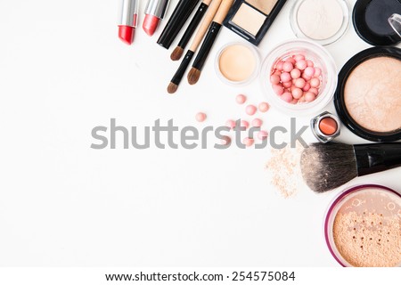 Brush and cosmetic isolated on a white background. Top view.