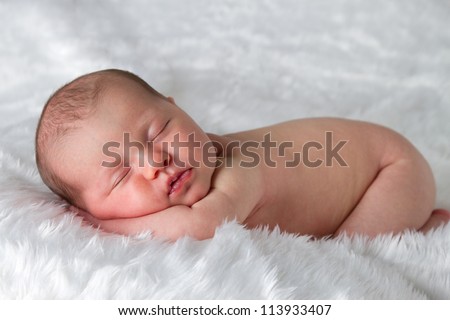 Newborn baby peacefully sleeping