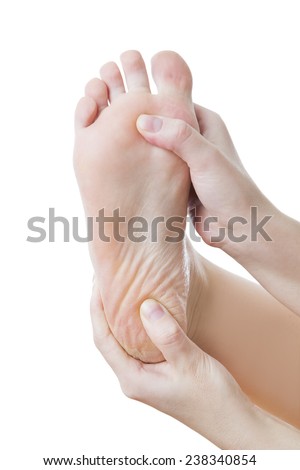 Đau ở chân. Massage chân nữ. Móng chân. Bị cô lập trên nền trắng.