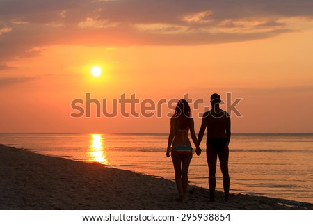https://thumb1.shutterstock.com/display_pic_with_logo/812812/295938854/stock-photo-romantic-couple-silhouette-on-the-beach-at-sunrise-295938854.jpg