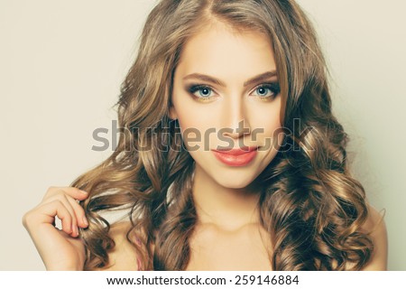 Beautiful woman with long curly hair