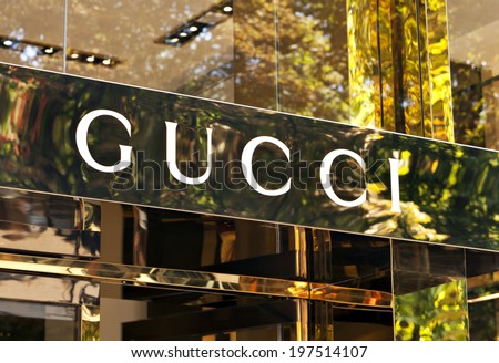 Dusseldorf, Germany - August 20, 2011: Gucci signage at store entrance. Gucci is an Italian fashion label owned by French company PPR. Gucci was founded by Guccio Gucci in Florence in 1921.