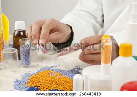 technician working with plastic granules