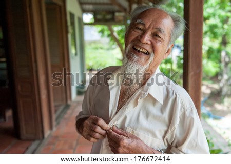 VINH LONG, VIETNAM - MARCH 7: Lively 89-year-old Vietnamese man on March 7, 2009 in the Mekong delta near Vinh Long. The Mekong delta is a major tourist destination to experience rural Vietnam.