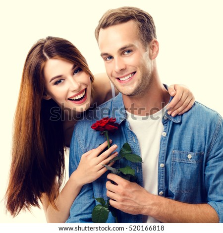 https://thumb1.shutterstock.com/display_pic_with_logo/82755/520166818/stock-photo-portrait-of-young-happy-hugging-couple-with-rose-close-to-each-other-with-smile-caucasian-models-520166818.jpg