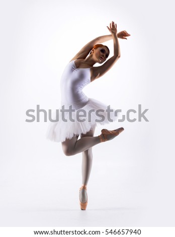 Young beautiful ballet dancer isolated over white background