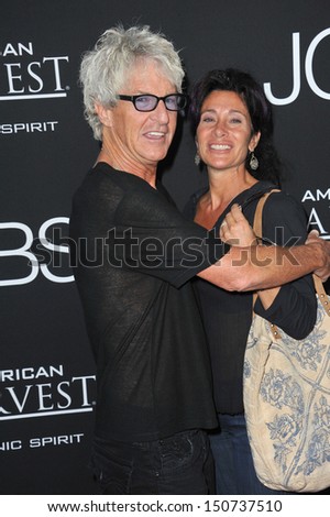 Reo Jobs Kevin Cronin, of REO Speedwagon, & wife at the Los Angeles premiere of "