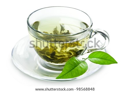 Cup with green tea and green leaves.