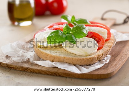 original Italian bruschetta with mozzarella and tomatoes - stock photo