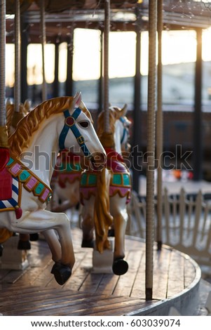 Children's carousel with horses outdoor