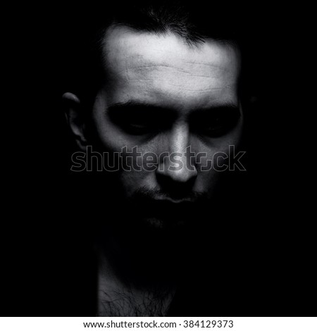 Portrait of man in shadow black and white Portrait of man in shadow black and white