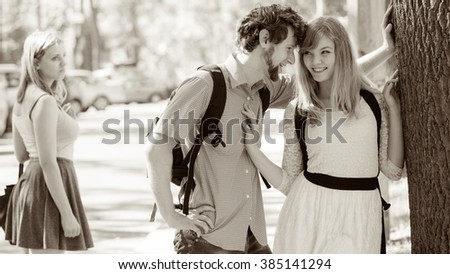 https://thumb1.shutterstock.com/display_pic_with_logo/854650/385141294/stock-photo-jealous-girl-looking-at-flirting-couple-outdoor-happy-young-woman-and-man-couple-dating-summer-385141294.jpg