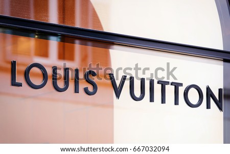 Rome, Italy - October 14, 2016: Louis Vuitton Sign of street shop window in Rome.