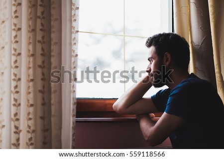 Young Sad Mad Sitting By Window Stock Photo 559118566 - Shutterstock