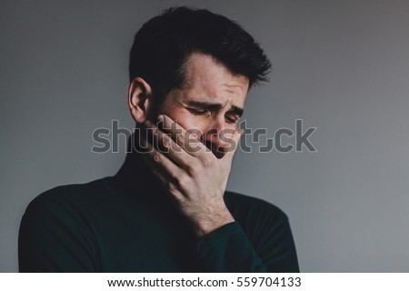 stock-photo-young-man-with-a-problem-crying-559704133.jpg