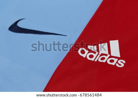BANGKOK, THAILAND - JULY 10, 2016: The Logo of Nike and Adidas Brand on Football Jerseys on July 10,2016 in Bangkok Thailand.