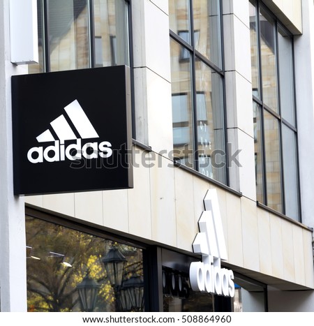 NURNBERG,GERMANY- November 1, 2016: Adidas logo on a wall. Adidas is a German multinational that manufactures sports shoes, clothing. It is the second biggest sportswear manufacturer in the world