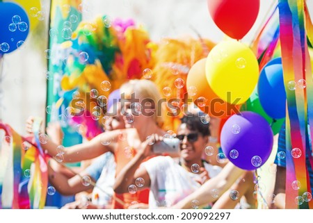 stock-photo-stockholm-aug-a-float-with-happy-persons-blowing-bubbles-at-the-crowd-during-stockholm-pride-209092297.jpg
