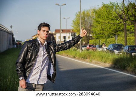 Boy hitchhiking — img 7
