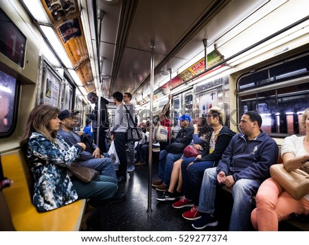 NEW YORK, USA - October 17, 2016. Inside New York City Subway Wagon with Other People in Background