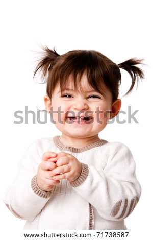 Beautiful expressive adorable happy cute laughing smiling baby infant toddler girl with ponytails showing teeth, isolated.