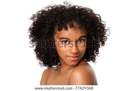 Beautiful happy Brazilian female face with smooth skin and dark curly hair, isolated.