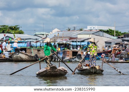 CAN THO,VIETNAM - 4 JUNE, 2011: Unidentified women at floating market in Mekong river delta. Cai Rang and Cai Be markets are central markets in delta and became popular tourist destination