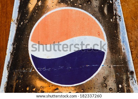 BANGKOK, THAILAND - MARCH 11, 2014: Close up old Pepsi logo printed on vintage enamel tag. Pepsi is a carbonated soft drink produced by PepsiCo, created in 1893 and introduced as Brand's Drink