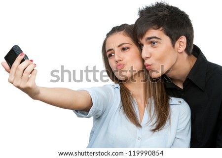 https://thumb1.shutterstock.com/display_pic_with_logo/900050/119990854/stock-photo-cute-young-couple-having-fun-taking-self-portrait-isolated-on-white-119990854.jpg