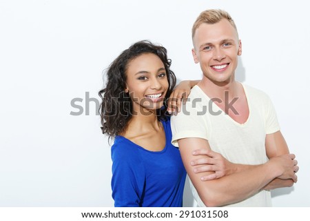 //thumb1.shutterstock.com/display_pic_with_logo/90989/291031508/stock-photo-mixed-couple-beautiful-young-mulatto-girl-standing-holding-her-arm-at-the-shoulder-of-blond-291031508.jpg