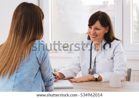Patient Having Consultation With Female Doctor In Office