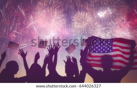 Patriotic holiday. Silhouettes of people holding the Flag of USA. America celebrate 4th of July.
